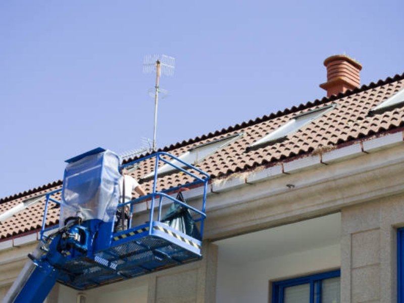 Residential roof leak repair showing shingles damage and repair work related to roof repair cost