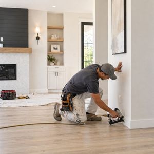 Professional exterior home remodel worker finishing house exterior